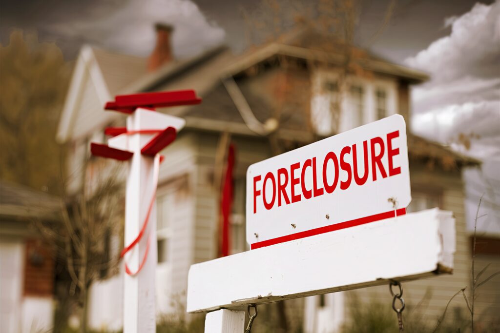 Close-up Foreclosure Sign in Front of House