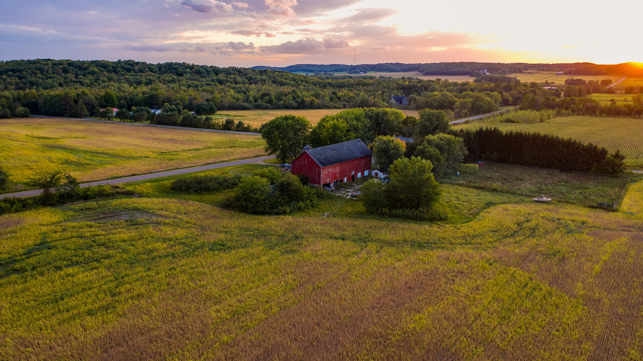 rural wisconsin red barn at sunset